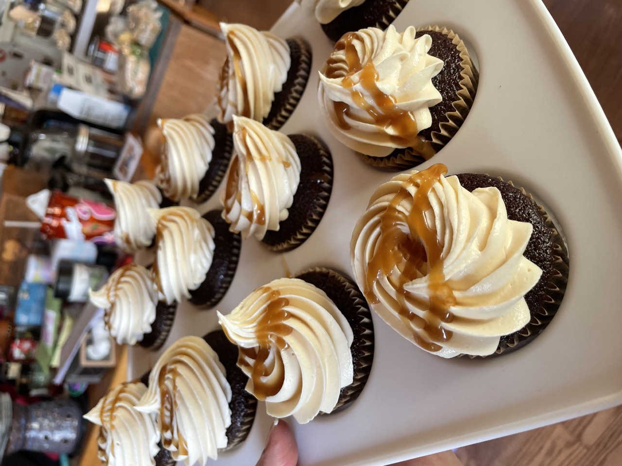 Chocolate cupcakes with vanilla buttercream and caramel drizzle