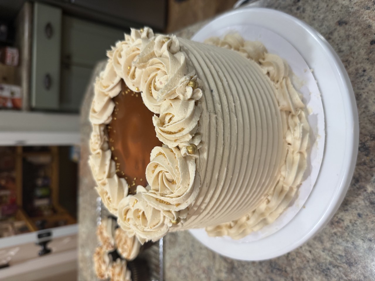Ridged buttercream cake with caramel center and rosette piping